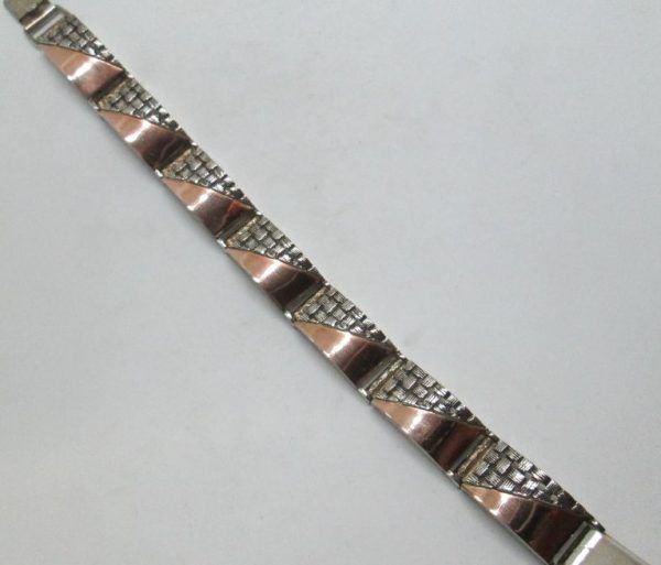 Handmade sterling silver rose gold bracelet combined in contemporary design bracelet. Dimension 1.2 cm X 18 approximately.