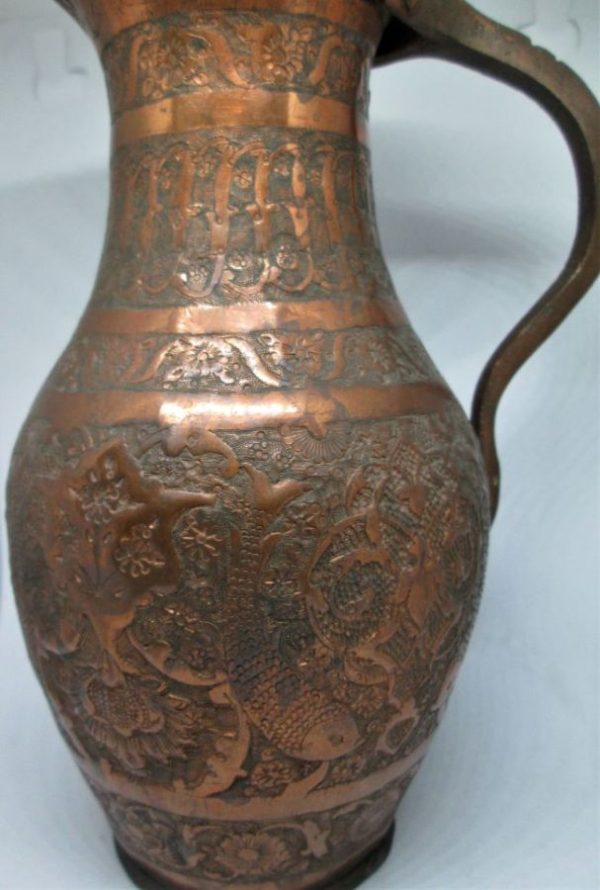 Handmade Vintage Metal Copper Jar from the middle east with foliage designs around early 20th century. Dimension diameter 11 cm X 21 cm.