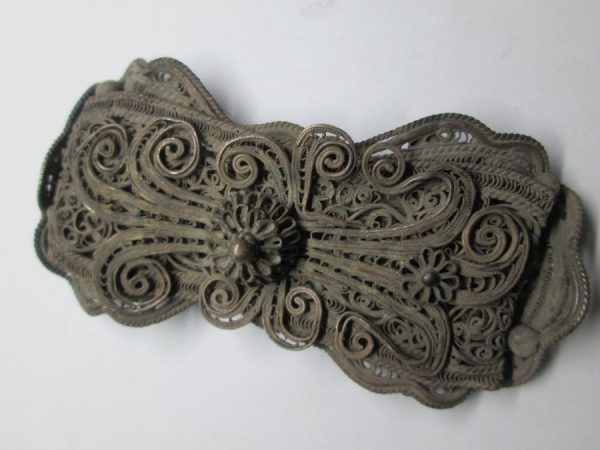 Brass belt buckle silver plated handmade fine filigree made in Europe late 19th century, probably France. Dimension 8 cm X 3.9 cm approximately.
