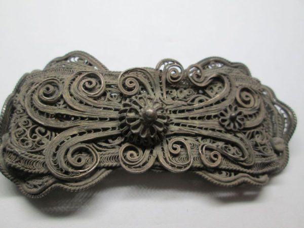 Brass belt buckle silver plated handmade fine filigree made in Europe late 19th century, probably France. Dimension 8 cm X 3.9 cm approximately.