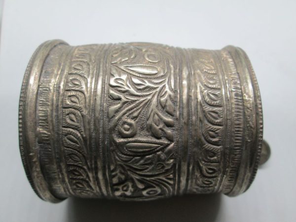 Vintage jewelry wide bracelet handmade low silver bracelet hand hammered different designs made by middle East nomads 8 cm X diameter 7.5 cm approximately.
