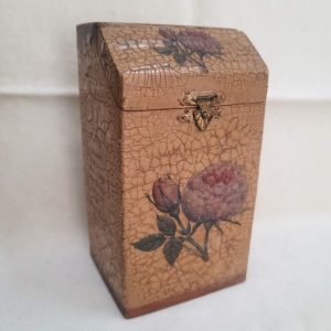 Handmade Wood Zedaka charity box with home blessings in Hebrew and English languages and floral hand painted design 14 cm X 7 cm X 7.6 cm approximately.