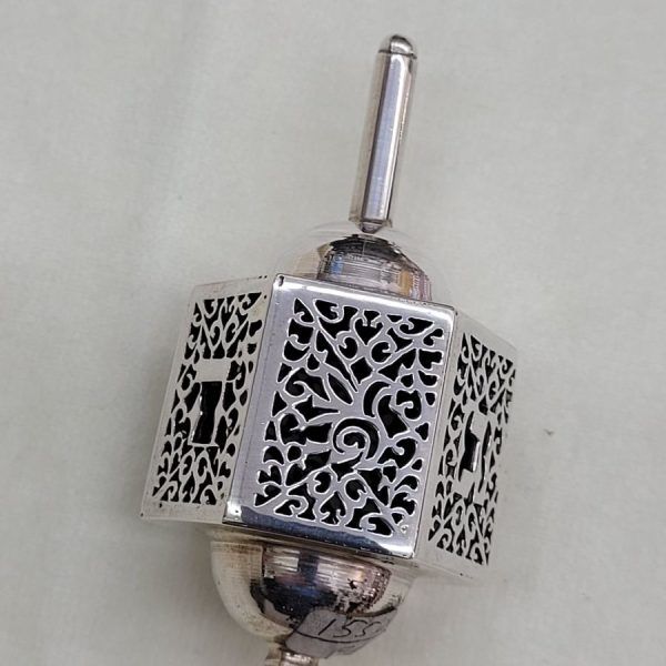Handmade sterling silver cut out dreidel hexagon shape cut out designs. Dimension  3.3 cm X 3.7 cm X 7.5 cm approximately.