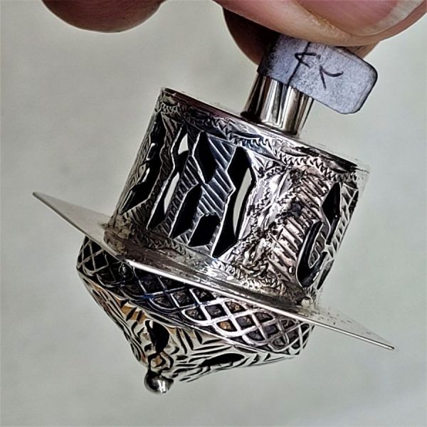Dreidel Sterling Silver Handmade. Handmade sterling silver dreidel Yemenite filigree & gold filled bead . Dimension 3 cm X 3 cm X 4.9 cm.