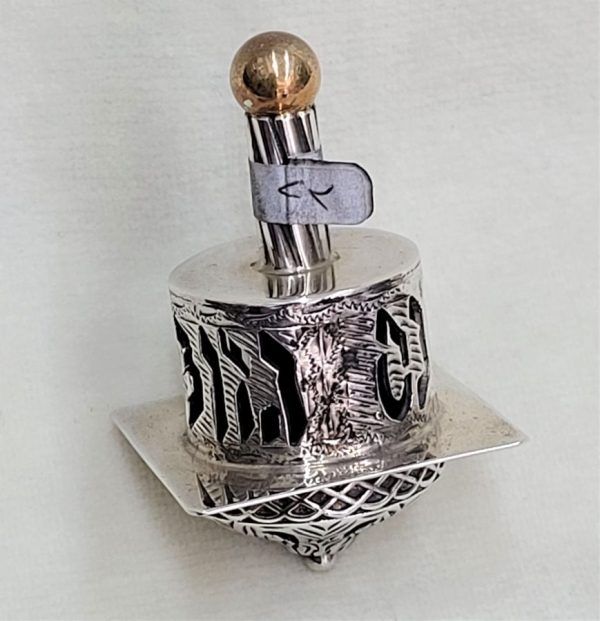 Dreidel Sterling Silver Handmade. Handmade sterling silver dreidel Yemenite filigree & gold filled bead . Dimension 3 cm X 3 cm X 4.9 cm.