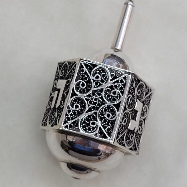 Handmade sterling silver Dreidel Silver Filigree Hexagon filigree Yemenite around six sides. Dimension 4 cm X 3.7 cm X 7.6 cm approximately.
