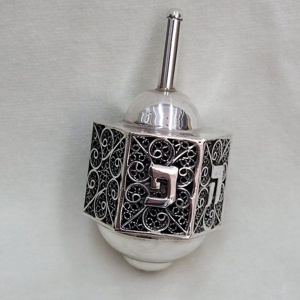 Handmade sterling silver Dreidel Silver Filigree Hexagon filigree Yemenite around six sides. Dimension 4 cm X 3.7 cm X 7.6 cm approximately.