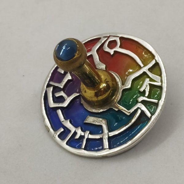 Handmade sterling silver & brass dreidel silver round enameled contemporary cut out designs set with colored enamel.
