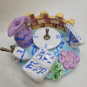Hanukah Dreidel Ceramic Set handmade. Hurwitz made this set of ceramic Chanukah Sevivon dreidel and a matching original stand.