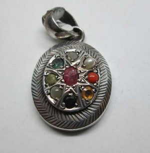 In center of pendant nine genuine stones are oval Ruby,  Pearl , Coral , yellow Topaz, blue Sapphire, Moon stone, Agate, Emerald and Cornelian stones.