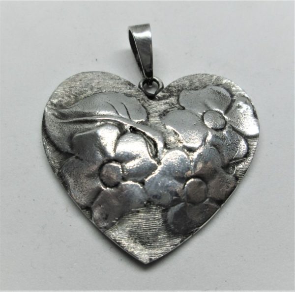 Sterling Silver Pendant Contemporary Heart shape with four leaves flowers shapes. Dimension 3.3 cm X 3.8 cm approximately.