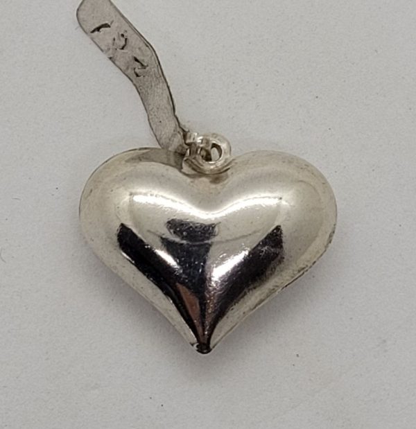 Handmade sterling silver heart shape pendant 3 dimension heart shape shiny smooth silver. Proper gift for Valentine day 2.5 cm X 2.5 cm approximately.