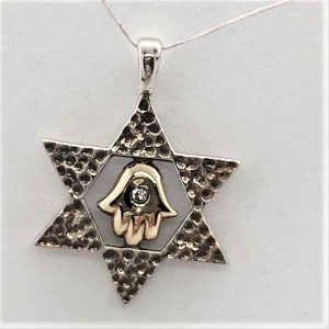 Sterling silver and 14 carat gold Magen David Star Pendant Hamsa set with white Zirconia stone.  Dimension 1.8 cm X 2.4 cm approximately.