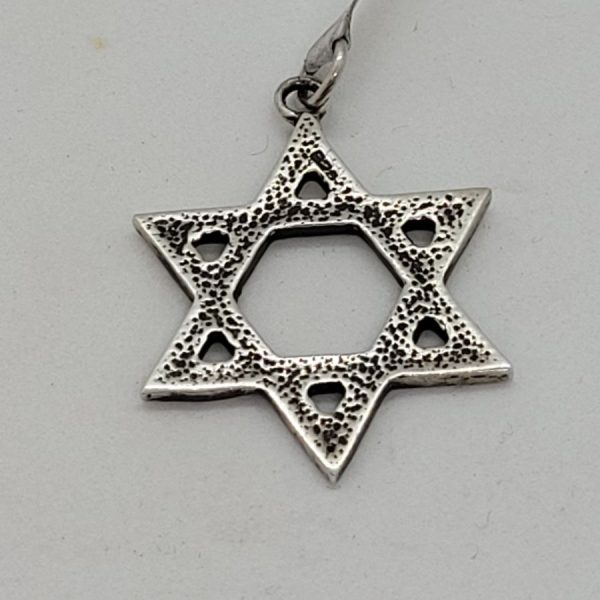 Handmade sterling silver Magen David pendant very heavy traditional style. Dimension 3.5 cm X 2.5 cm X 0.3 cm approximately.