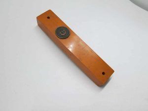 Vintage Mezuzah yellow plastic with a brass medallion with the letter "Shin" in Hebrew, made in Israel early 1950's.