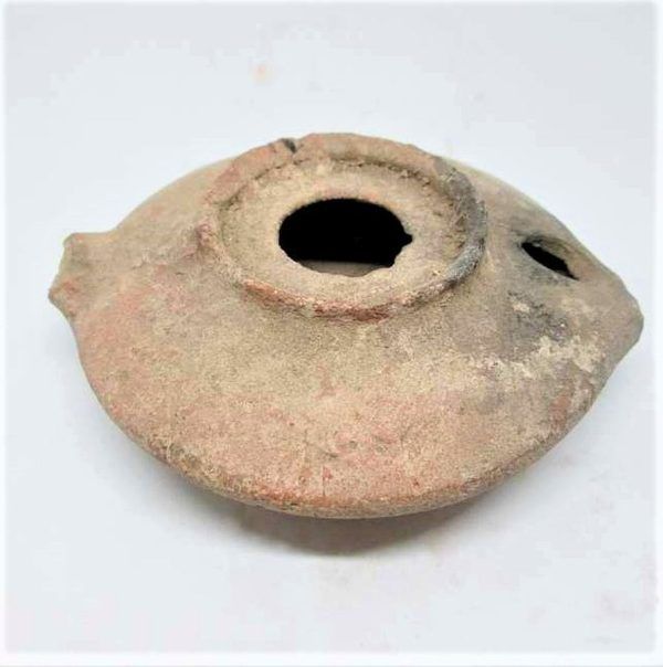 Antique pottery Oil Lamp Herodian Era 1st century CE.  It was found without its holding handle at the end. Part of a private collection.
