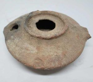 Antique pottery Oil Lamp Herodian Era 1st century CE.  It was found without its holding handle at the end. Part of a private collection.