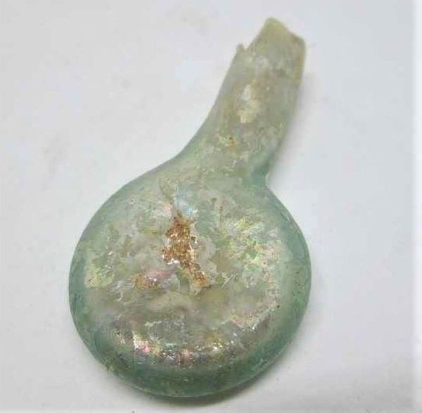 Genuine antique Small roman glass amphora found in Israel 1st century BC.  One can see the antique patina on it  made two millennium ago.