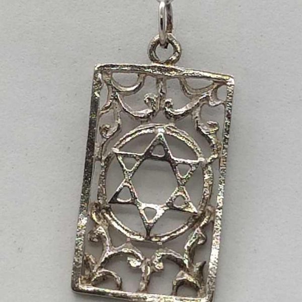 Handmade Magen David Cut Out pendant frame and floral designs in the frame. Dimension 1.5 cm X 2.9 cm X 0.1 approximately.