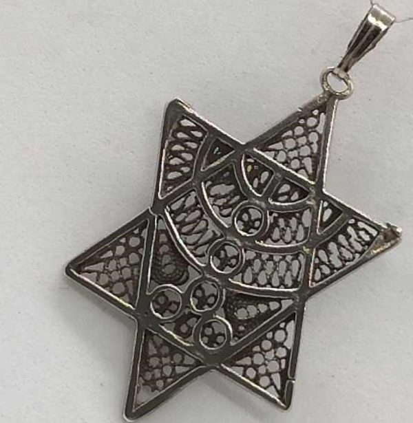 Fine Yemenite filigree work MagenDavid pendant filigree Menora designed skillfully into star. Dimension 2.3 cm X 3.6 cm approximately.