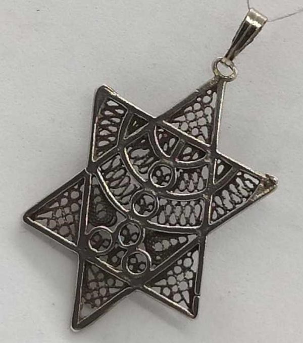 Fine Yemenite filigree work MagenDavid pendant filigree Menora designed skillfully into star. Dimension 2.3 cm X 3.6 cm approximately.