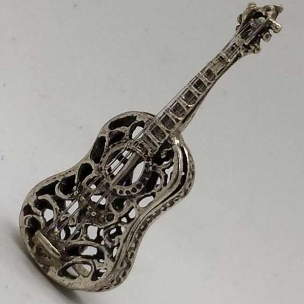Sterling Silver Miniature Guitar Cut Out Sculpture handmade with option to stand as seen in photos 1.4 cm X 1.6 cm X 4.2 cm approximately.