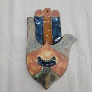 Handmade wall hanging glazed ceramic wall hanging tile Hamsa dove shape designed and made by Ruth Factor. Dimension 12.5 cm X 21 cm approximately.