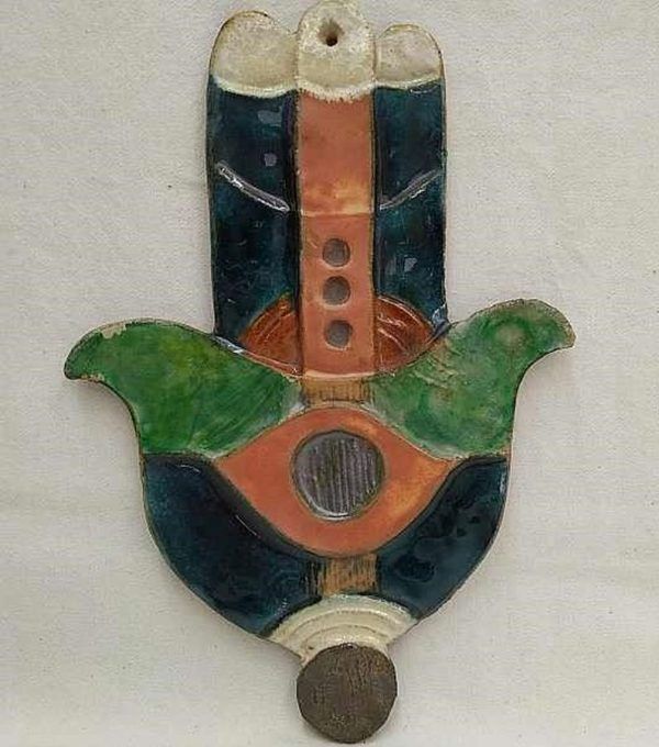 Handmade glazed ceramic wall hanging Tile Hamsa Chamsa Green designed and made by Ruth Factor. Dimension 15 cm X 22 cm approximately.
