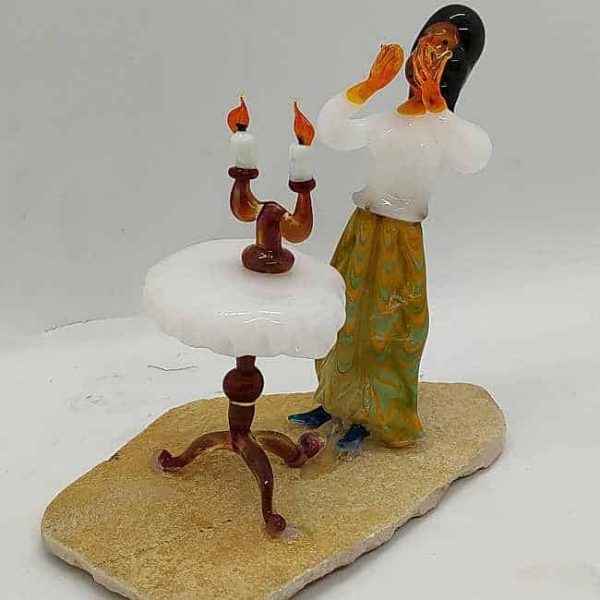 Mouth Blown Sculpture Sabbath Candlelight. Handmade and mouth blown glass sculpture by Borisov. A Jewish housewife lighting the Sabbath candles. He used a fine raw layer of Jerusalem stone as base.