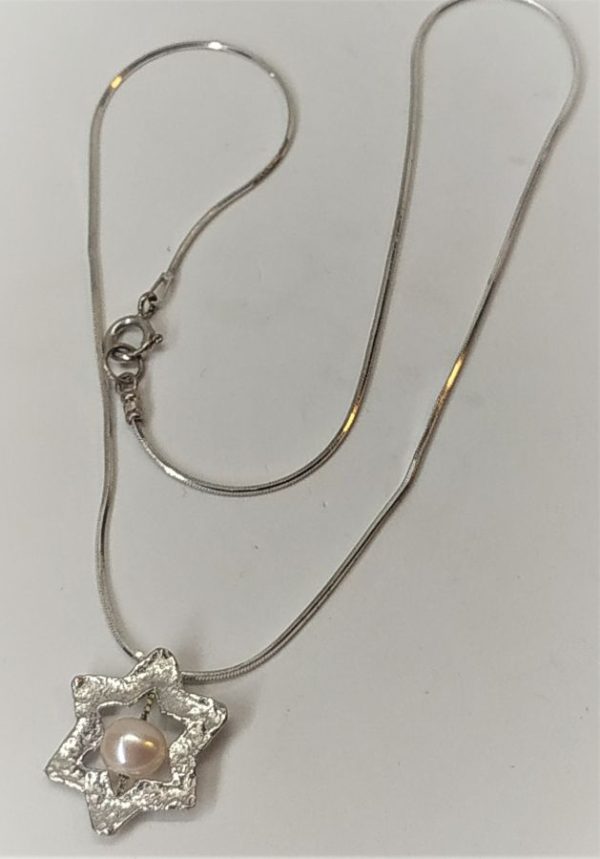 Silver MagenDavid Star Pendant Pearl handmade contemporary star with chain. The jeweler has fused the star and set a pearl.