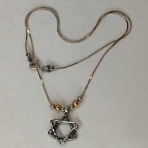 Contemporary David Star Gold Beads pendant gold beads with chain. The jeweler has added gold beads the abstract star.