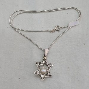 Silver MagenDavid Star Pendant Pearl handmade contemporary star with chain. The jeweler has fused the star and set a pearl.