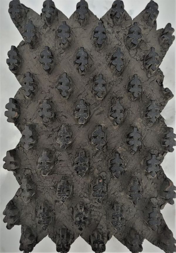 Vintage Textile Pattern Wood Rectangular. Ancient textile pattern carved in hard black wood from the middle East 19th century.