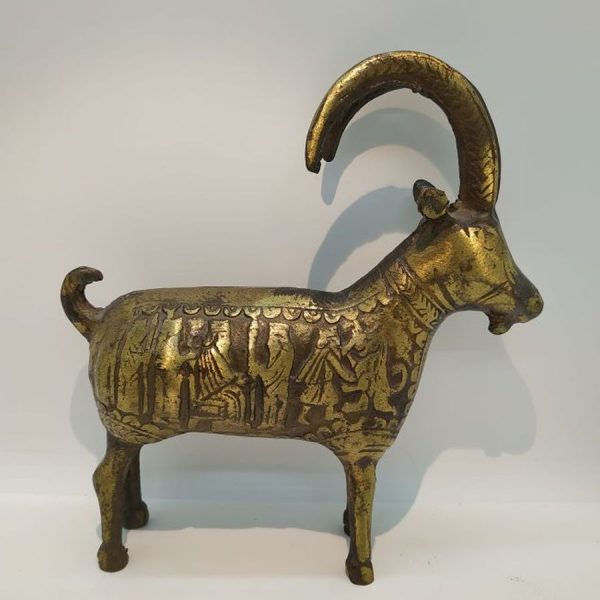 Vintage Brass Statue Antelope handmade. A vintage brass statue Antelope with big rounded horns with warriors design around animal body.