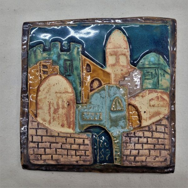 Handmade glazed ceramic tile Jerusalem wall made by Ruth Factor exhibiting the different old construction in old city of Jerusalem.