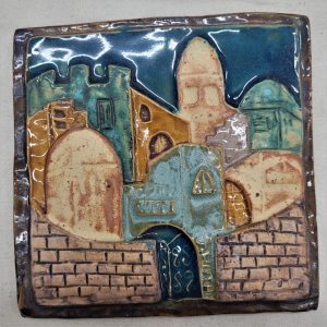 Handmade glazed ceramic tile Jerusalem wall made by Ruth Factor exhibiting the different old construction in old city of Jerusalem.