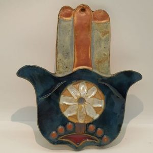 Handmade wall hanging glazed  Ceramic Tile Hamsa Round with round design in center of Hamsa, designed and made by Ruth Factor.