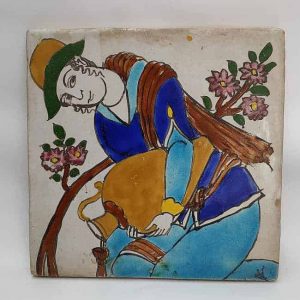 Vintage Ceramic Tile Woman handmade. A middle East nomadic woman pouring water to a plant with typical robe. Dimension 20.2 cm X 20.2 cm approximately.
