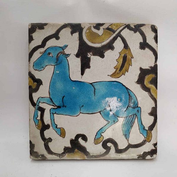 Vintage Ceramic Tile Horse blue colored. Handmade glazed ceramic tile vintage made in middle East 19th century. A blue horse showing his trained steps.