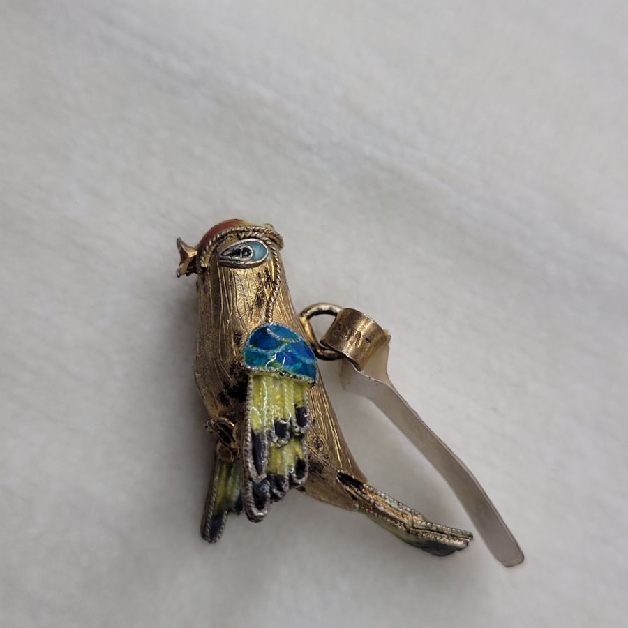 Handmade sterling silver pendant exotic parrot gold plated and covered with blue and white enamel. Dimension 3.4 cm X 2.4 cm 1.3 cm approximately.