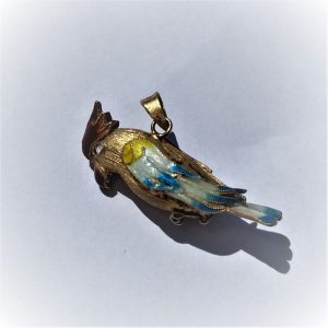 Handmade sterling silver pendant exotic parrot gold plated and covered with blue and white enamel. Dimension 3.4 cm X 2.4 cm 1.3 cm approximately.