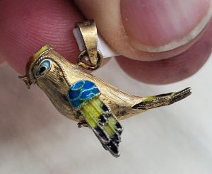 Handmade sterling silver pendant exotic parrot gold plated and covered with blue and white enamel. Dimension 3.4 cm X 2.4 cm 1.3 cm approximately.