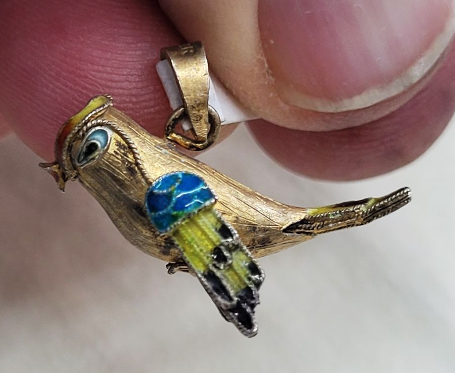 Handmade sterling silver pendant exotic parrot gold plated and covered with blue and white enamel. Dimension 3.4 cm X 2.4 cm 1.3 cm approximately.