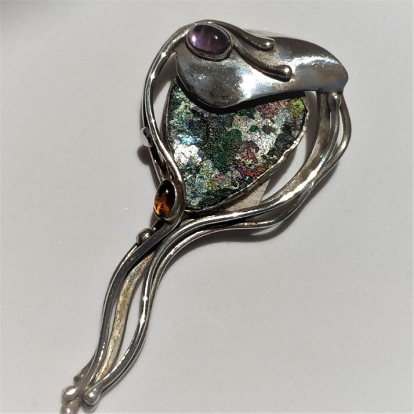Roman Glass Silver Pendant and can be used as a pin as well , handmade by Y. Perez. Dimension 3.4 cm X 7.1 cm X 1 cm approximately.