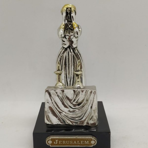 Handmade sterling silver Statue Wife Lighting Candlelight of a Jewish housewife lighting Sabbath candles and praying for her family.
