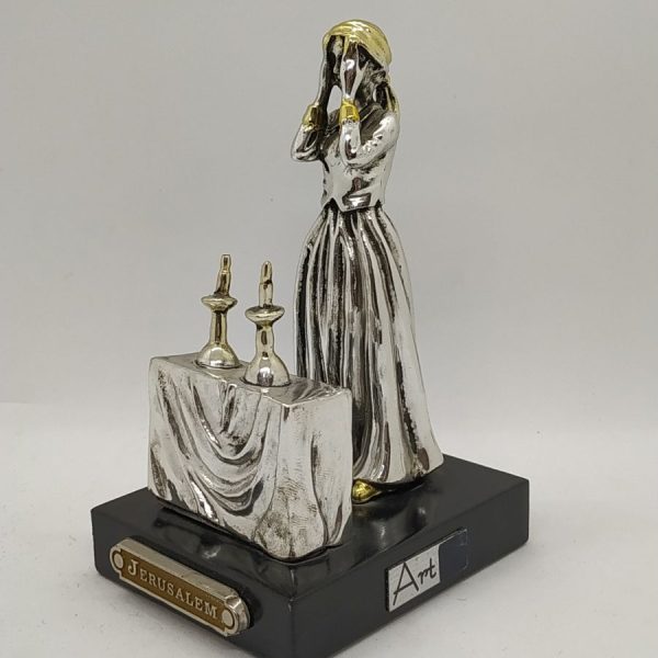 Handmade sterling silver Statue Wife Lighting Candlelight of a Jewish housewife lighting Sabbath candles and praying for her family.