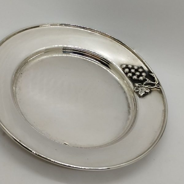 Handmade sterling Grapes Kiddush Cup Saucer made in Israel. It is hand embossed with vine grapes designs around top of saucer.