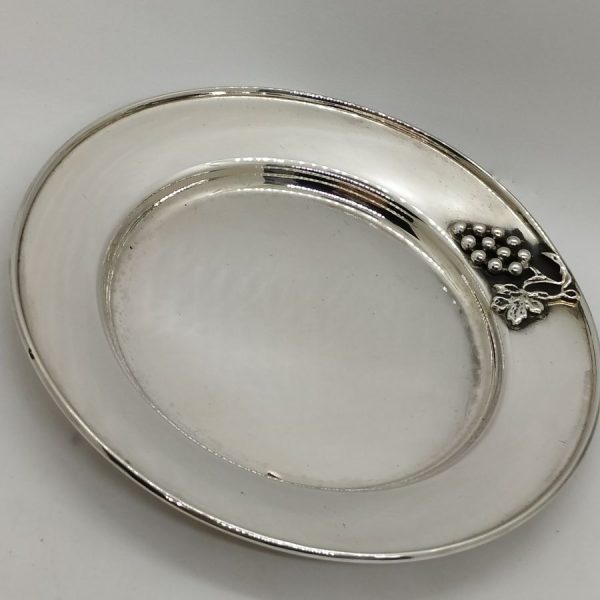 Handmade sterling Grapes Kiddush Cup Saucer made in Israel. It is hand embossed with vine grapes designs around top of saucer.