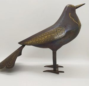An antique Safavid iron dove with 24 carat gold inlaid designs made in the middle East aged 16th century. Dimension 28 cm X 10 cm X 20 cm.