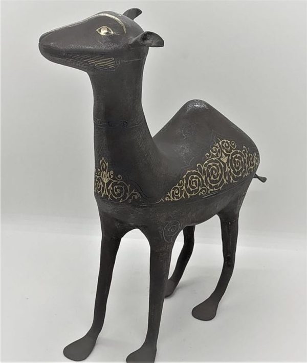 An antique Safavid iron Camel with 24 carat gold inlaid designs made in middle East during the 16th century. Dimension 28 cm X 10 cm X 20 cm.